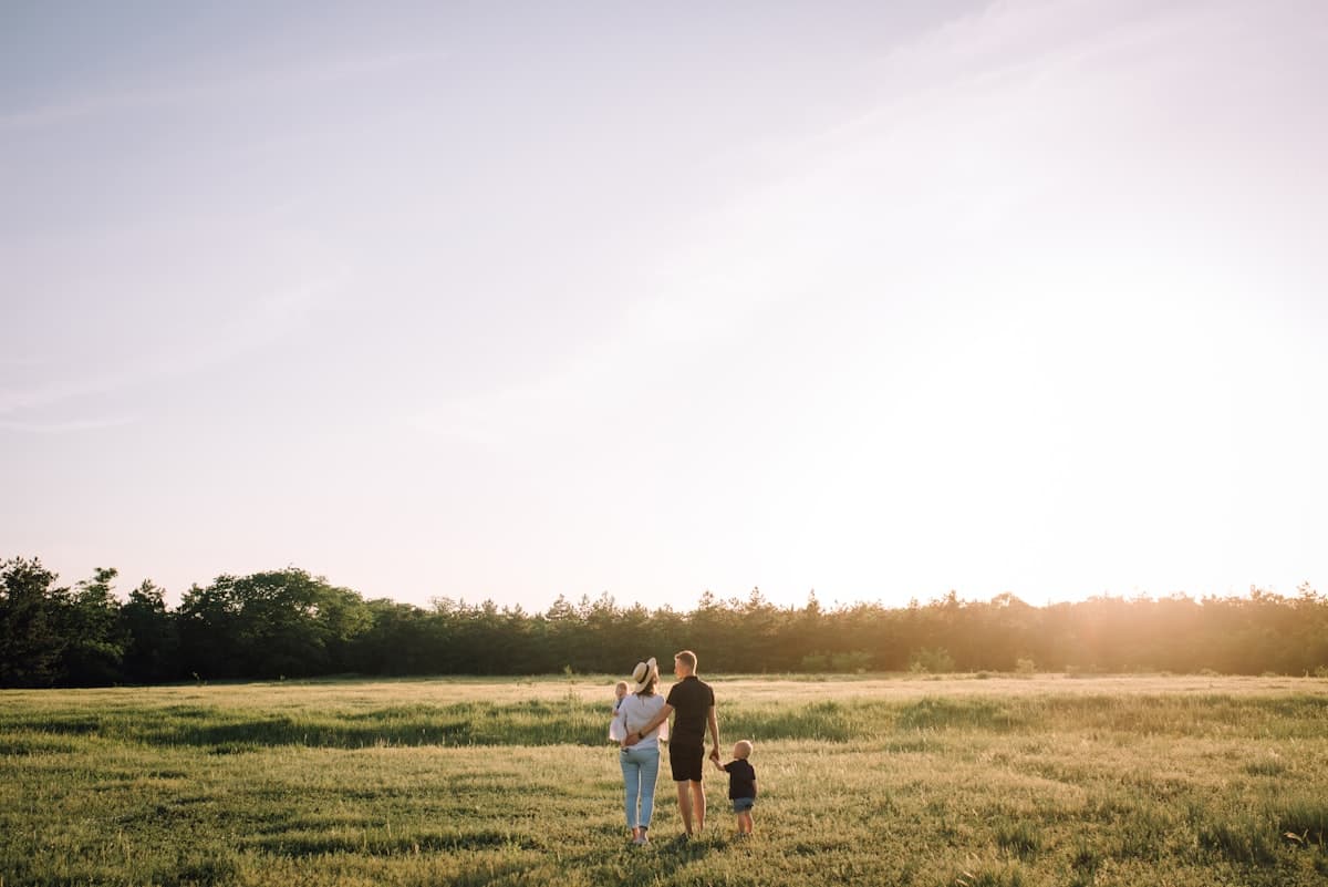 A family walking together outdoors at golden hour